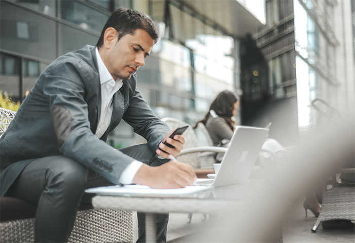 Man working on his laptop outside