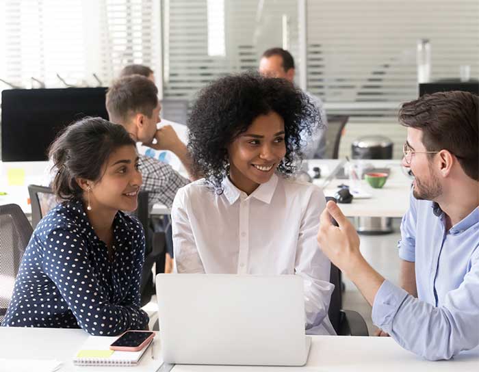 Workers looking at a computer.