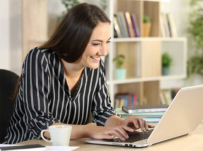 Woman typing on computer.