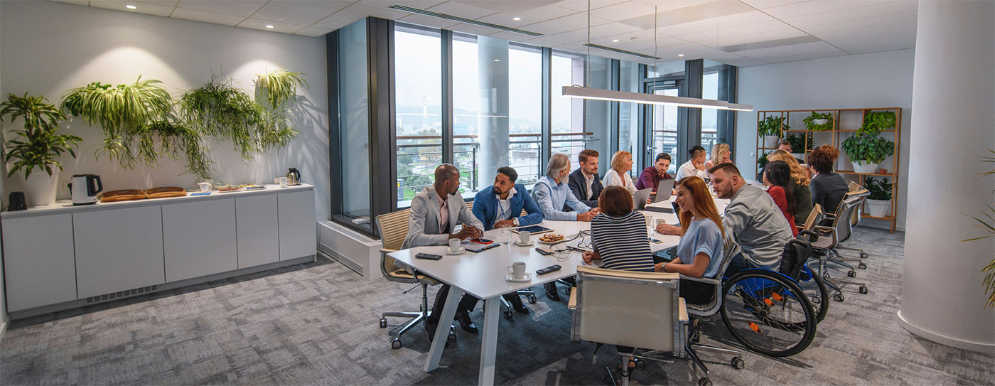 Employees sitting around a conference table.
