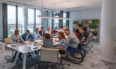 Employees sitting around a conference table.
